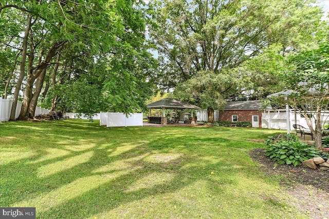 136 Schoolhouse Ln, Glen Mills, PA 19342 - fenced backyard featuring a gazebo and a patio