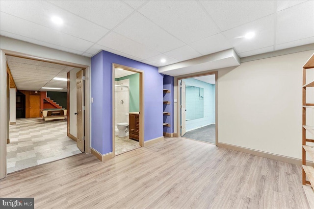 136 Schoolhouse Ln, Glen Mills, PA 19342 - spare room with wood finished floors, a drop ceiling, and stairs