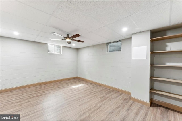 136 Schoolhouse Ln, Glen Mills, PA 19342 - below grade area featuring light wood-style flooring, a drop ceiling, and concrete block wall