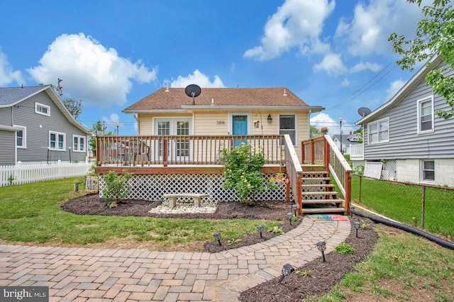 3816 Chesapeake Beach Rd, Chesapeake Beach, MD 20732 - rear view of house featuring a fenced backyard and a wooden deck