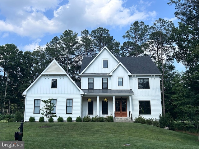 11606 Little Bay Harbor Way, Spotsylvania, VA 22551 - modern farmhouse featuring covered porch, a front yard, a standing seam roof, and board and batten siding