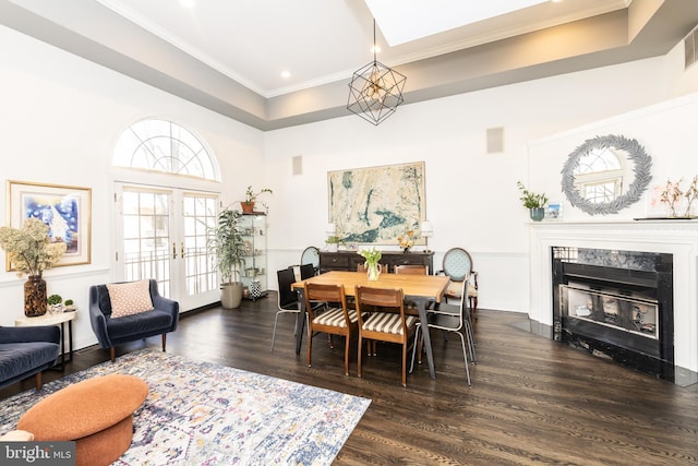 216 Christian St Unit E, Philadelphia, PA 19147 - dining space with dark wood-style flooring, crown molding, a fireplace, recessed lighting, and a tray ceiling