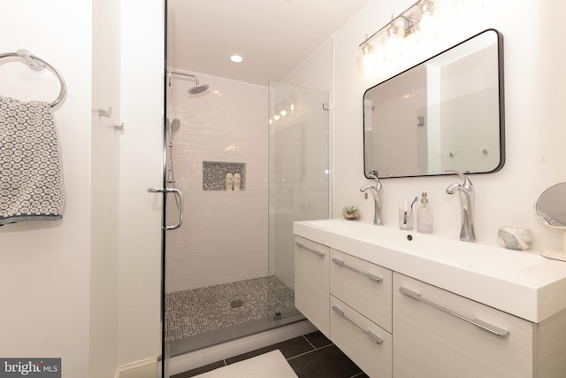 216 Christian St Unit E, Philadelphia, PA 19147 - bathroom featuring vanity, tile patterned flooring, a stall shower, and recessed lighting