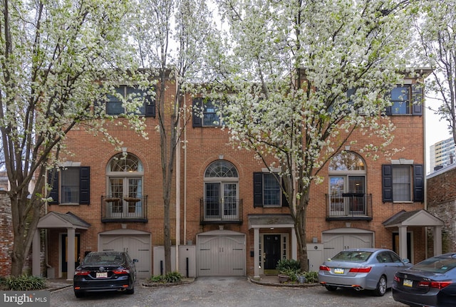 216 Christian St Unit E, Philadelphia, PA 19147 - view of front of house with brick siding and a gate