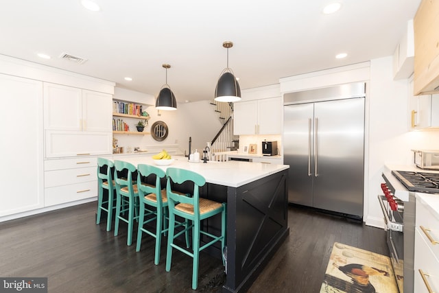 216 Christian St Unit E, Philadelphia, PA 19147 - kitchen featuring high quality appliances, open shelves, light countertops, white cabinetry, and recessed lighting