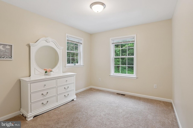 1442 Peacock Ln, Hellertown, PA 18055 - unfurnished bedroom featuring multiple windows and carpet floors
