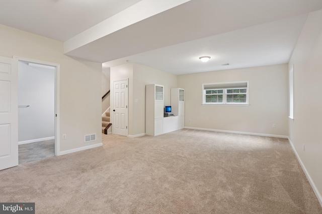 1442 Peacock Ln, Hellertown, PA 18055 - carpeted empty room with stairway and baseboards