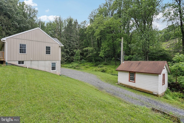 1442 Peacock Ln, Hellertown, PA 18055 - view of side of home featuring a lawn and board and batten siding