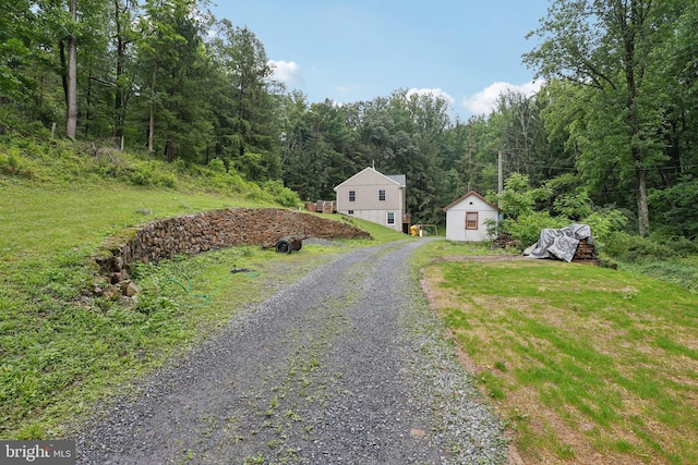 1442 Peacock Ln, Hellertown, PA 18055 - view of dirt / gravel driveway featuring a forest view