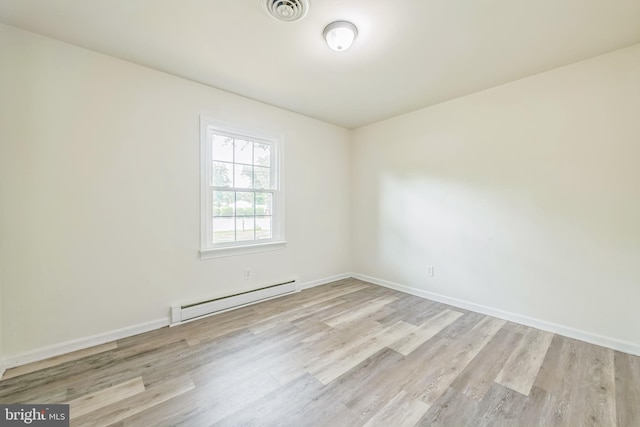 10401 W Huguenot Rd, North Chesterfield, VA 23224 - unfurnished room with a baseboard heating unit and wood finished floors