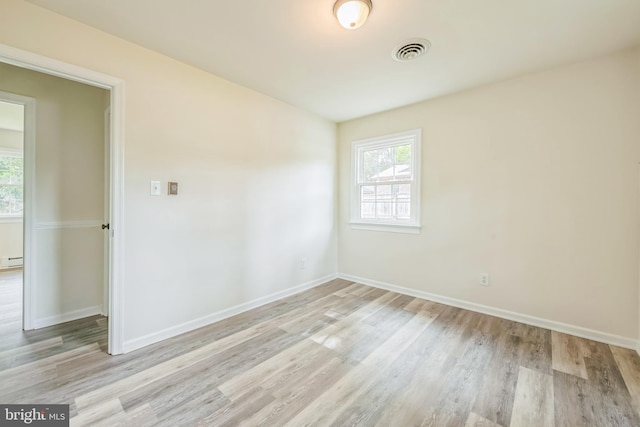 10401 W Huguenot Rd, North Chesterfield, VA 23224 - unfurnished room with wood finished floors and a baseboard radiator