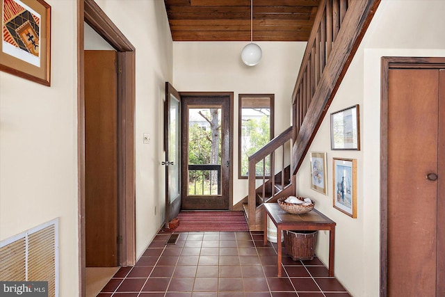 35197 Hassell Ave, Bethany Beach, DE 19930 - entrance foyer featuring stairs, dark tile patterned floors, and wood ceiling