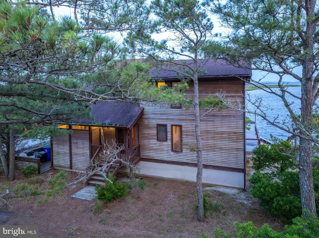 35197 Hassell Ave, Bethany Beach, DE 19930 - back of house with roof with shingles, a water view, and a porch
