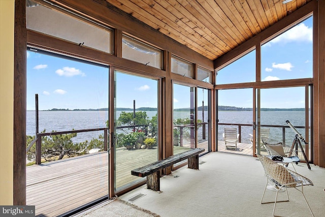 35197 Hassell Ave, Bethany Beach, DE 19930 - unfurnished sunroom with a water view, carpet floors, lofted ceiling, wood ceiling, and expansive windows