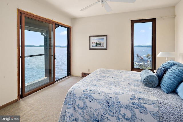 35197 Hassell Ave, Bethany Beach, DE 19930 - bedroom featuring a water view, light colored carpet, access to exterior, and ceiling fan