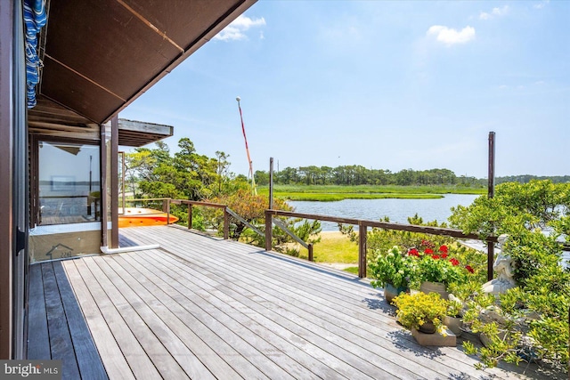 35197 Hassell Ave, Bethany Beach, DE 19930 - wooden deck featuring a water view and view of wooded area