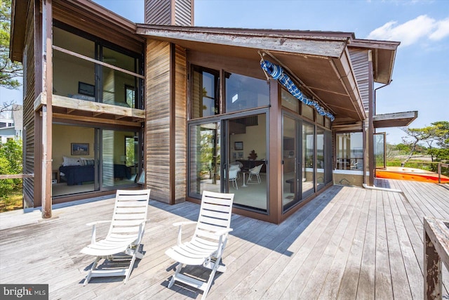 35197 Hassell Ave, Bethany Beach, DE 19930 - wooden terrace featuring a sunroom