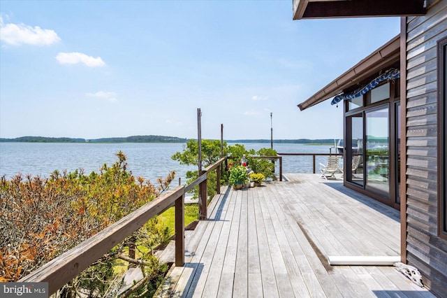 35197 Hassell Ave, Bethany Beach, DE 19930 - wooden deck featuring a water view