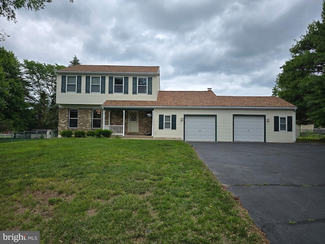 1802 Robin Dr, Hatfield, PA 19440 - view of front facade with covered porch, an attached garage, and asphalt driveway