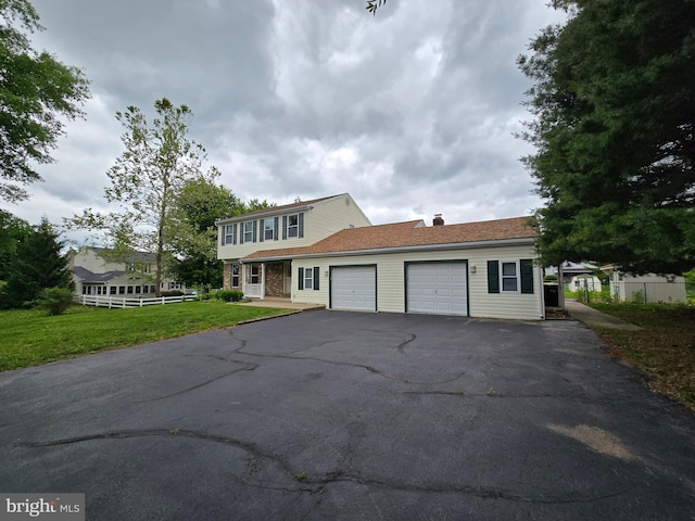 1802 Robin Dr, Hatfield, PA 19440 - view of front of home with an attached garage, asphalt driveway, and a chimney