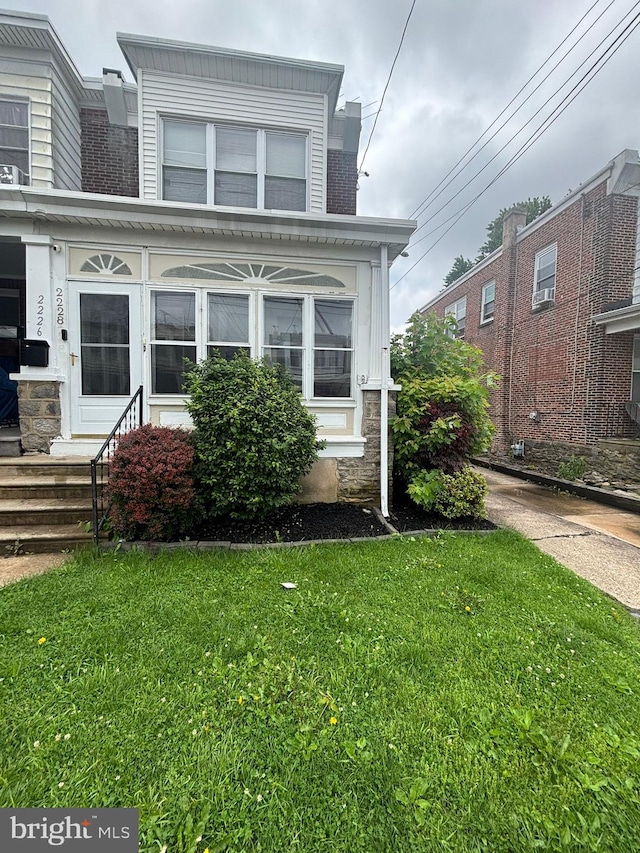 2228 Manor Ave, Upper Darby, PA 19082 - view of front facade with a front yard and stone siding