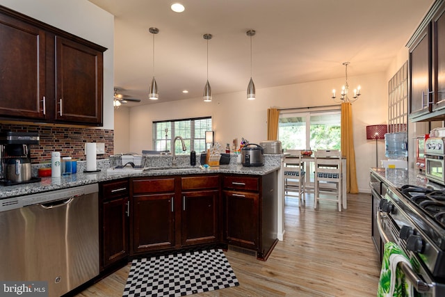 55 Hamlet Cir, Mechanicsburg, PA 17050 - kitchen featuring appliances with stainless steel finishes, a peninsula, a chandelier, plenty of natural light, and recessed lighting