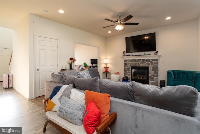 55 Hamlet Cir, Mechanicsburg, PA 17050 - living area with light wood-type flooring, ceiling fan, recessed lighting, a stone fireplace, and radiator