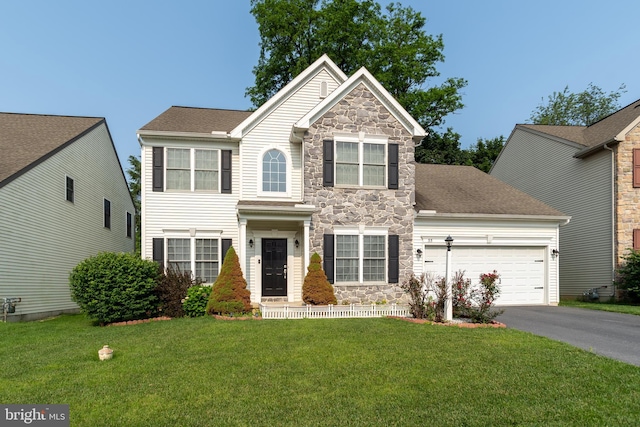 55 Hamlet Cir, Mechanicsburg, PA 17050 - view of front of house featuring stone siding, asphalt driveway, a garage, and a front yard