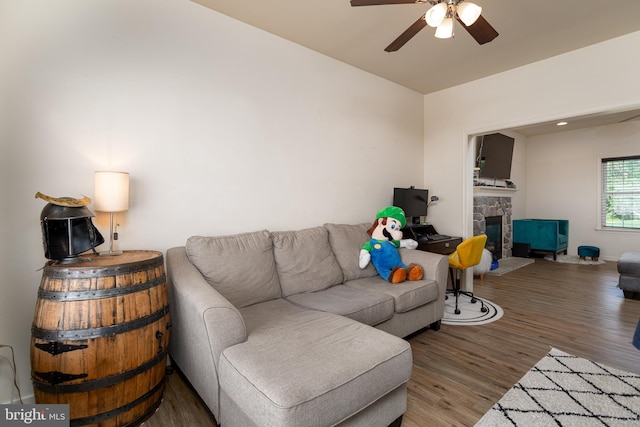 55 Hamlet Cir, Mechanicsburg, PA 17050 - living room with wood finished floors, ceiling fan, and a stone fireplace