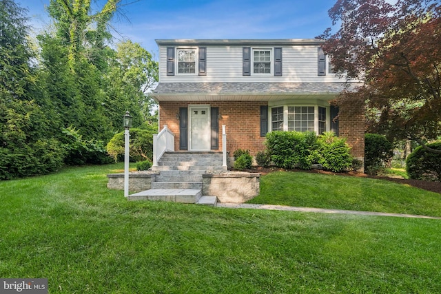 1243 Grove Rd, West Chester, PA 19380 - traditional home with a front lawn, brick siding, and a shingled roof
