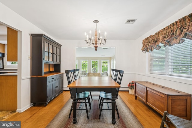 1243 Grove Rd, West Chester, PA 19380 - dining space featuring a chandelier, light wood-style flooring, a baseboard radiator, and a baseboard heating unit