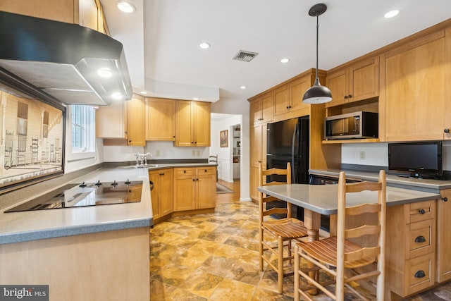 1243 Grove Rd, West Chester, PA 19380 - kitchen with exhaust hood, stainless steel microwave, electric stovetop, recessed lighting, and freestanding refrigerator