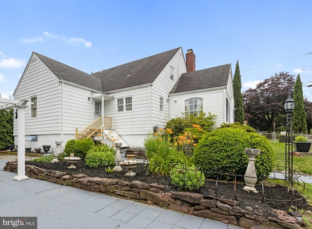 1606 W Mcgalliard Ave, Hamilton, NJ 08610 - view of home's exterior featuring a chimney and a shingled roof