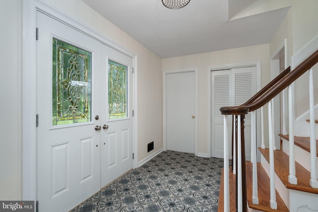 92 Lochatong Rd, Ewing, NJ 08628 - foyer entrance with stairway and french doors