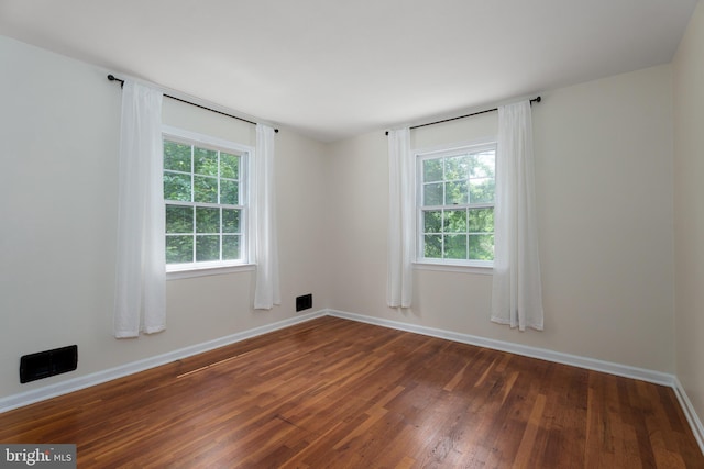 92 Lochatong Rd, Ewing, NJ 08628 - spare room with dark wood-type flooring and healthy amount of natural light