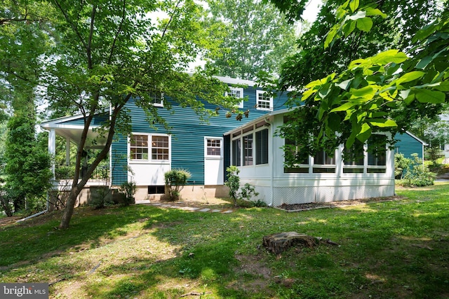 92 Lochatong Rd, Ewing, NJ 08628 - view of front of home featuring a front yard and a sunroom