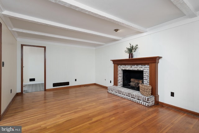92 Lochatong Rd, Ewing, NJ 08628 - unfurnished living room with beam ceiling, a fireplace, and light wood-style floors