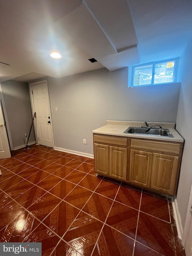 3805 Arbutus, Baltimore, MD 21207 - kitchen featuring dark tile patterned floors and light countertops