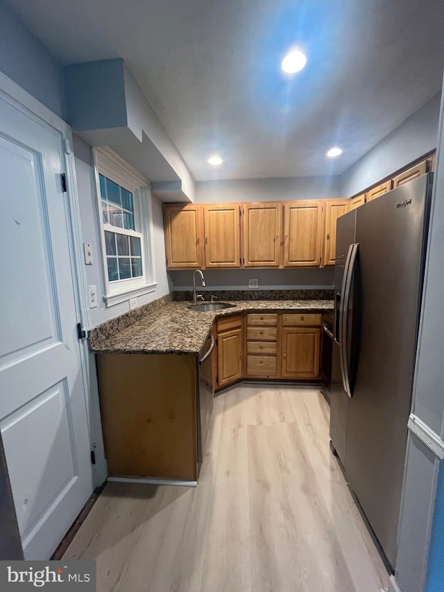 3805 Arbutus, Baltimore, MD 21207 - kitchen featuring refrigerator with ice dispenser, dishwasher, light wood-style floors, dark stone counters, and recessed lighting
