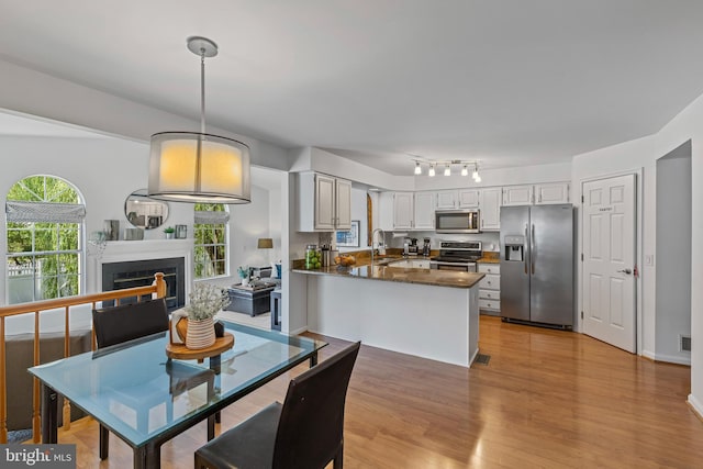 1908 Brigade Way, Odenton, MD 21113 - dining space featuring light wood-style floors and a fireplace