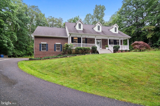 11871 Knollcrest Ln, La Plata, MD 20646 - cape cod-style house with brick siding, covered porch, and a front lawn