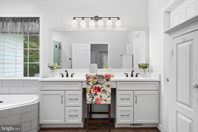 11871 Knollcrest Ln, La Plata, MD 20646 - bathroom featuring vanity, a bath, and wood finished floors