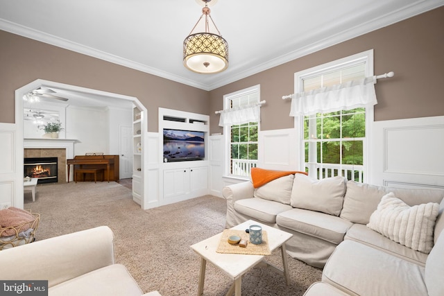 11871 Knollcrest Ln, La Plata, MD 20646 - living area with a decorative wall, crown molding, carpet flooring, a wainscoted wall, and a tiled fireplace
