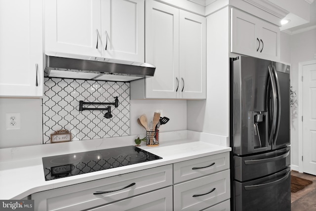 11871 Knollcrest Ln, La Plata, MD 20646 - kitchen featuring stainless steel refrigerator with ice dispenser, under cabinet range hood, black electric cooktop, white cabinetry, and tasteful backsplash