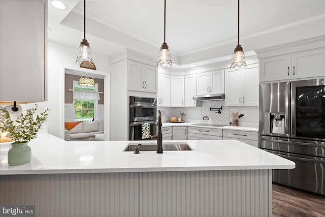 11871 Knollcrest Ln, La Plata, MD 20646 - kitchen with stainless steel appliances, tasteful backsplash, light countertops, ornamental molding, and dark wood finished floors