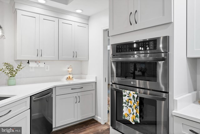 11871 Knollcrest Ln, La Plata, MD 20646 - kitchen featuring appliances with stainless steel finishes, light countertops, recessed lighting, dark wood-style flooring, and white cabinets