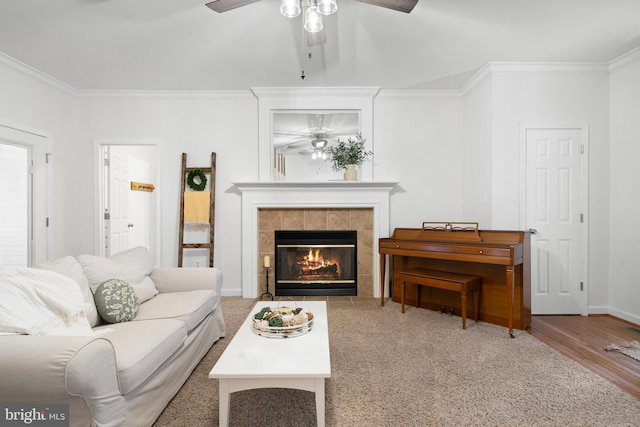 11871 Knollcrest Ln, La Plata, MD 20646 - living room featuring ceiling fan, ornamental molding, wood finished floors, and a fireplace