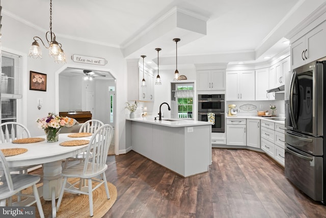 11871 Knollcrest Ln, La Plata, MD 20646 - kitchen featuring stainless steel appliances, ceiling fan, a peninsula, light countertops, and dark wood-style floors