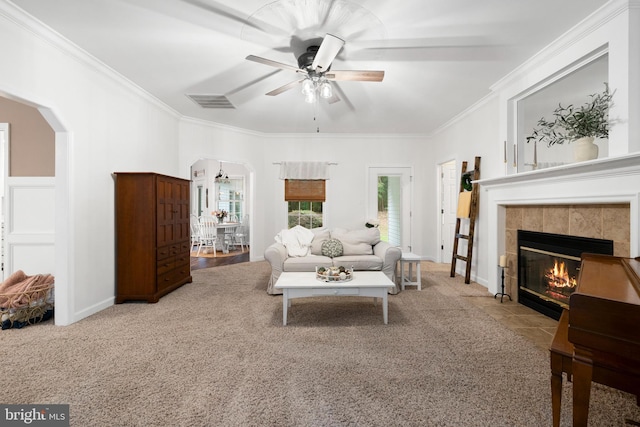 11871 Knollcrest Ln, La Plata, MD 20646 - carpeted living room with arched walkways, ornamental molding, a ceiling fan, and a fireplace