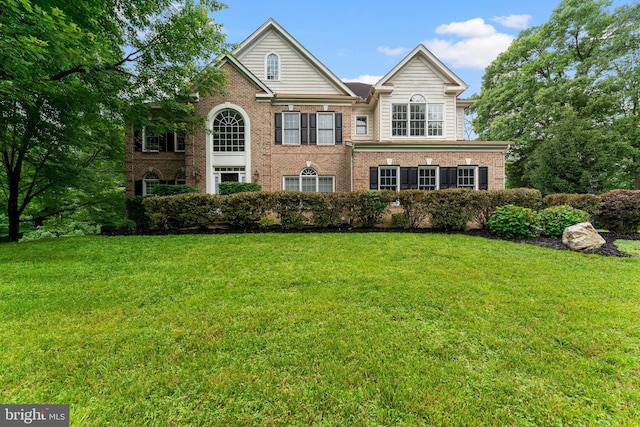 7412 Kallenburg Ct, Manassas, VA 20111 - colonial-style house with brick siding and a front yard